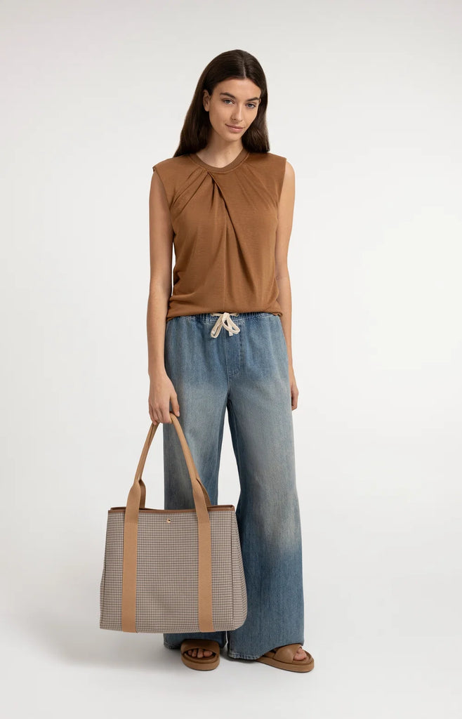 Sleeveless top with pleated neckline
