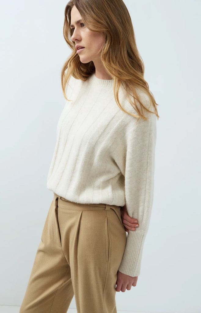 Sweater with drawcord hem